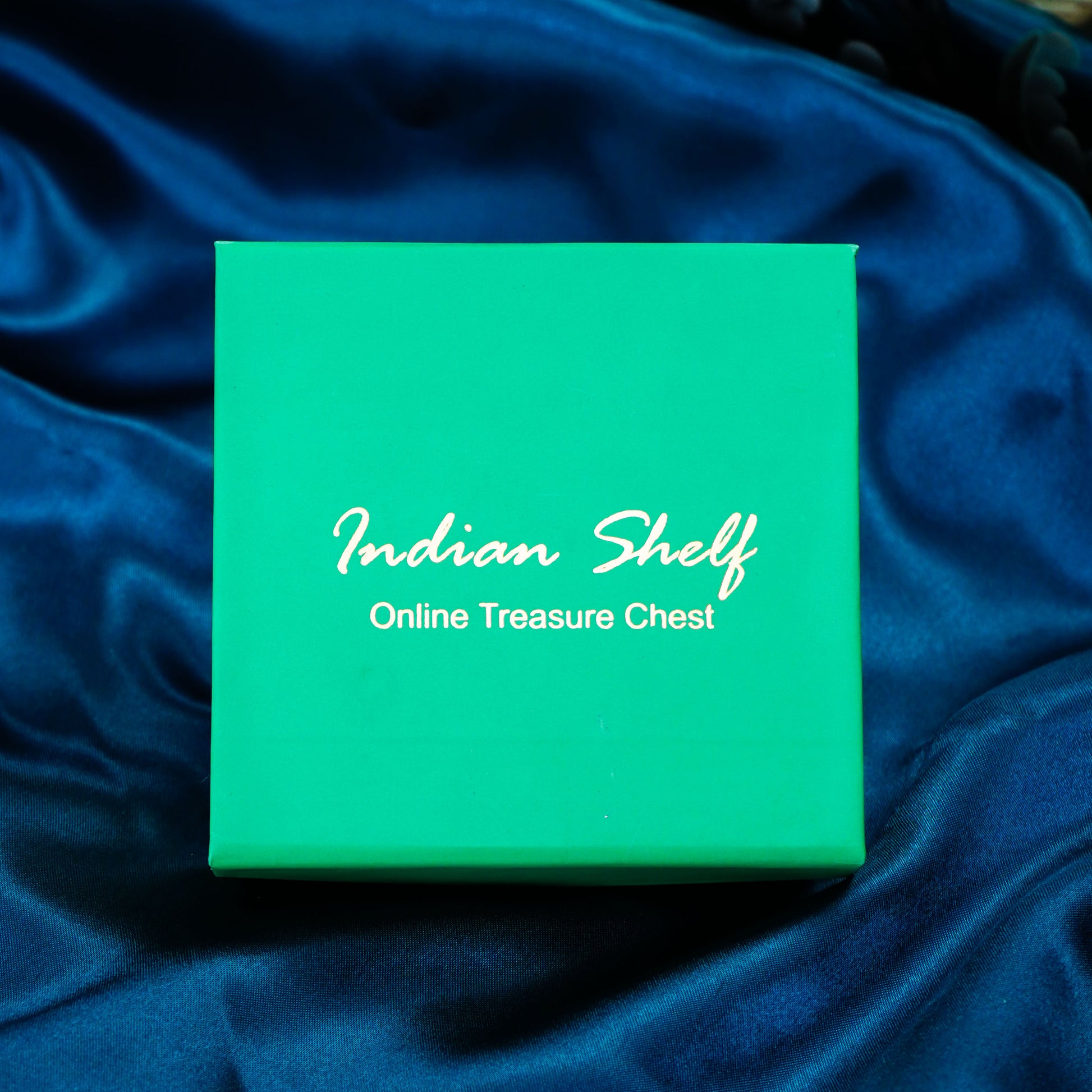 Side angle showing garnet hoop earrings with purple & silver tones.