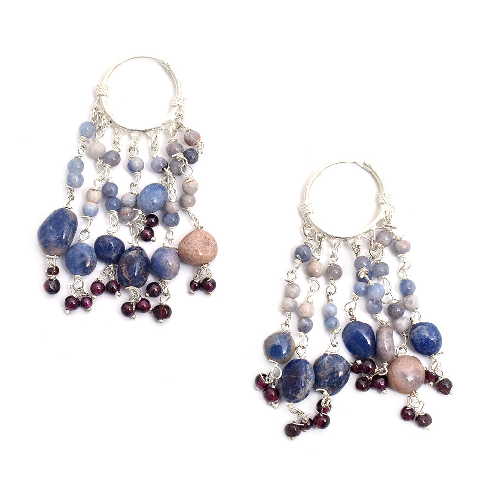 Lifestyle shot showing the size and drop of the blue beaded hoop hoop earrings made from 92.5 Sterling Silver.