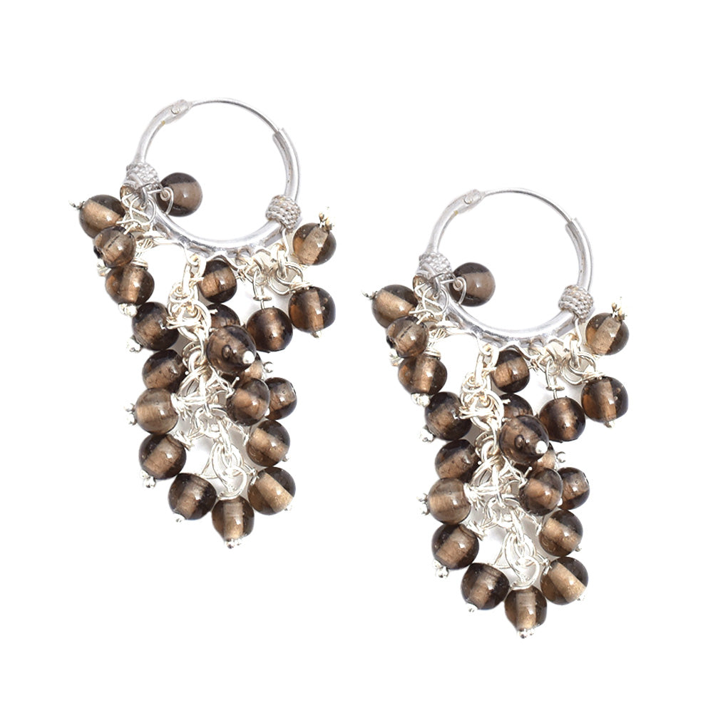 Lifestyle shot showing the size and drop of the brown bunch hoop hoop earrings made from 92.5 Sterling Silver.