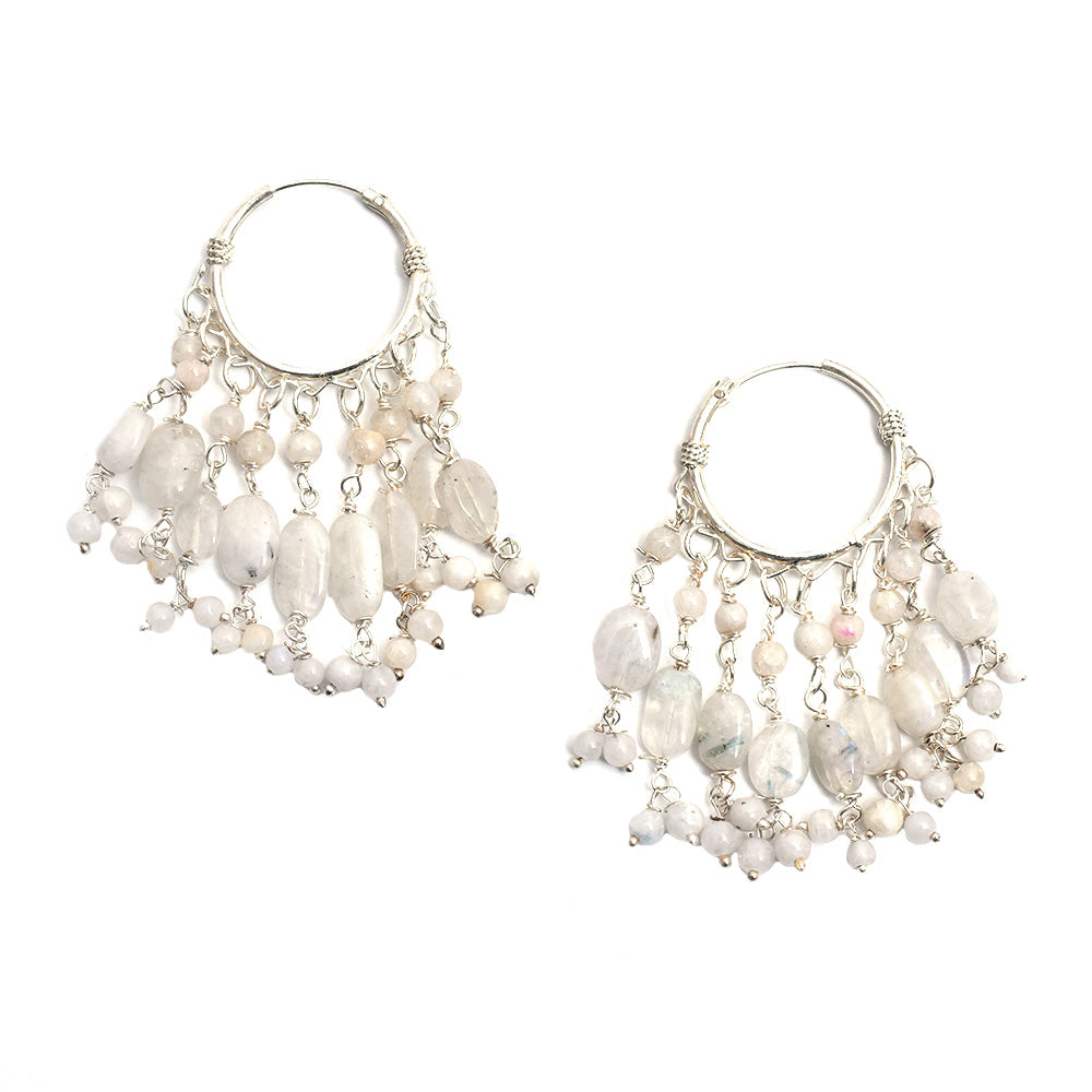 Lifestyle shot showing the size and drop of the silvera white beaded drop earrings made from 92.5 Sterling Silver.