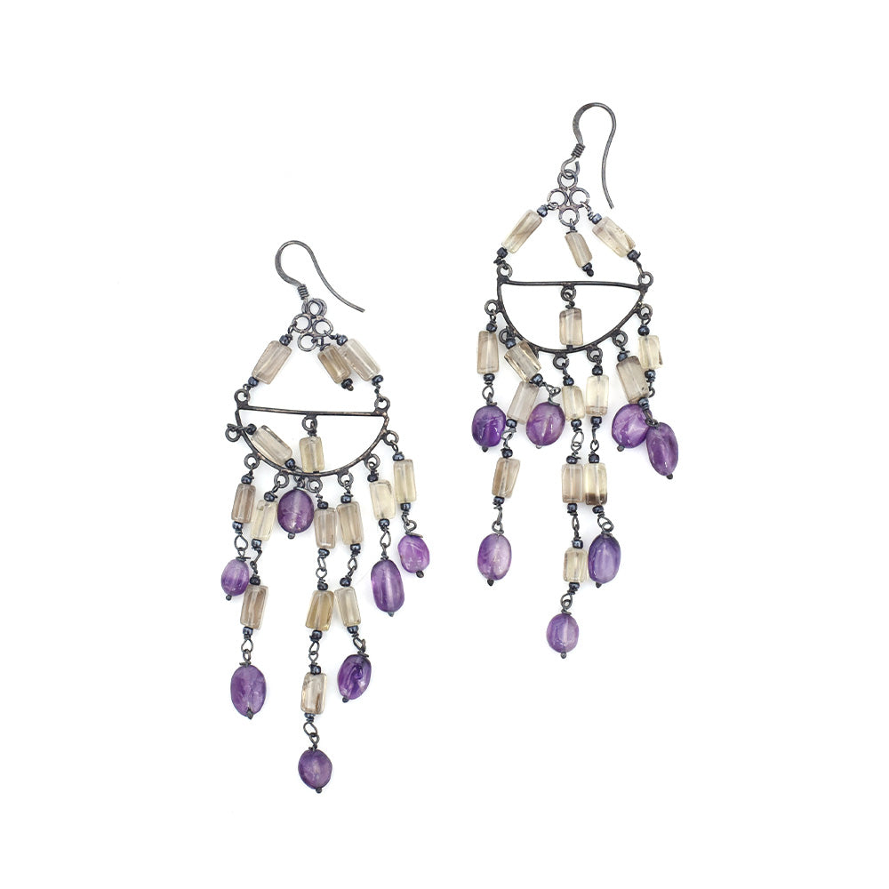 Pair of adorable daily wearable earrings laid flat, displaying handcrafted craftsmanship in 92.5 Sterling Silver.