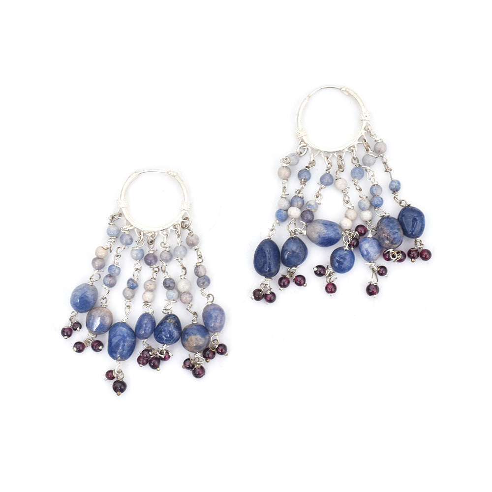 Pair of adorable blue stone earrings laid flat, displaying handcrafted craftsmanship in 92.5 Sterling Silver.