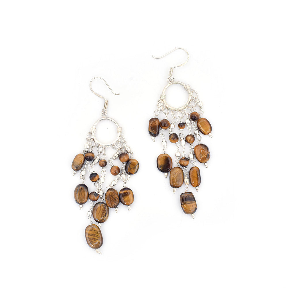 Pair of tiger eye beads earrings laid flat, displaying handcrafted craftsmanship in 92.5 Sterling Silver.