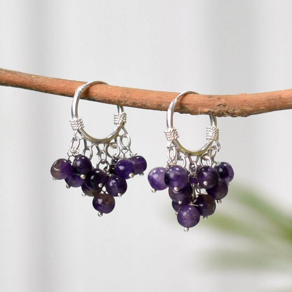 Pair of Small Purple Stone Hoop Earrings on a display stand, crafted from 92.5 Sterling Silver.