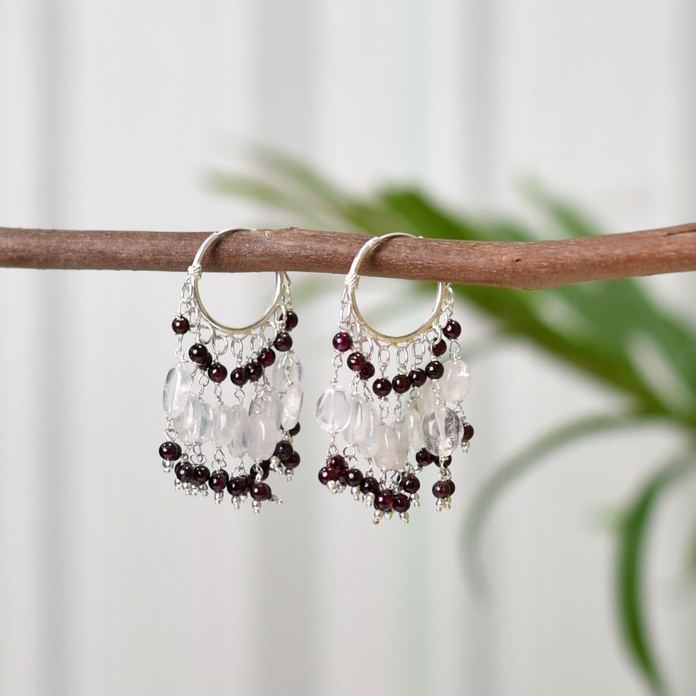 Close-up of intricate details on these 92.5 Sterling Silver garnet hoop earrings.